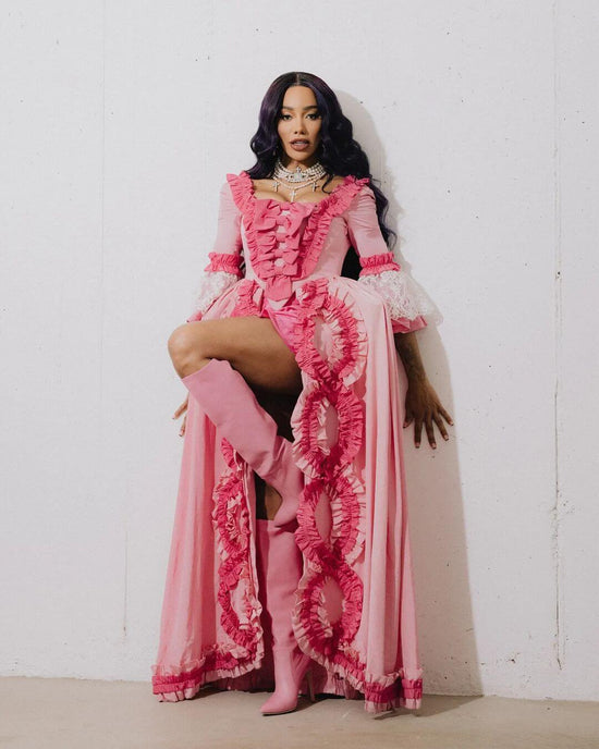 Munroe Bergdorf wears a bespoke set of Vellva vegan pearls paired with a Moschino couture pink dress
