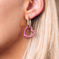 Gold tone earrings with heart shaped pendants in gold tone with pink coloured zircon stones.